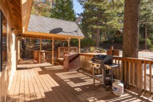 deck with outdoor seating and grill