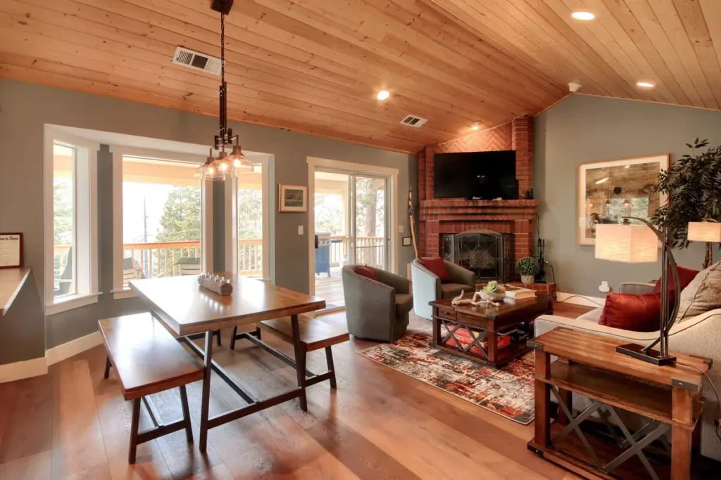 living room with television and fireplace