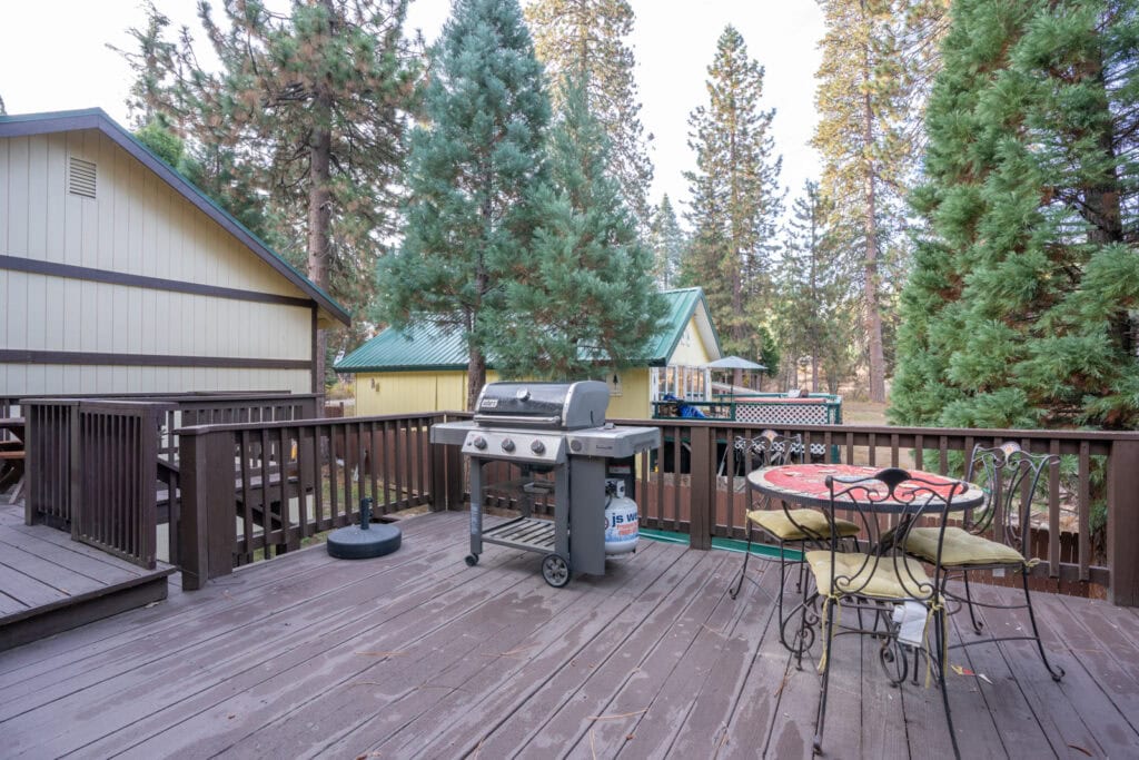 deck with outdoor seating and grill