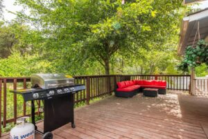 deck with grill and outdoor seating