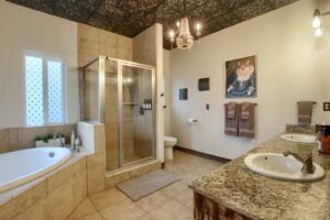 bathroom with shower and soaking tub